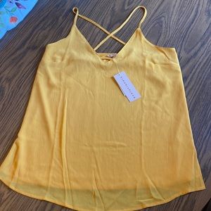 NWT Evolutionary brand yellow/gold tank with crosscross back. Size Medium